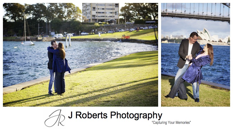 Couple dancing on the grass in front of sydney harbour at blues point reserve - pre wedding portraits sydney